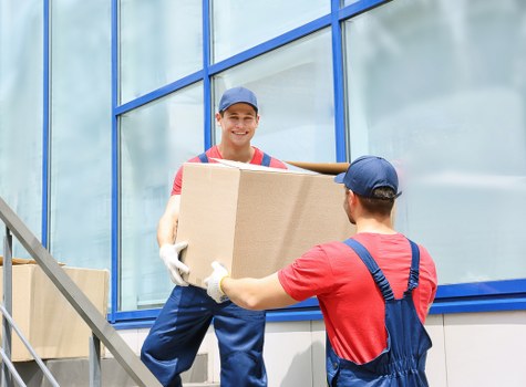 Packed moving boxes and furniture ready for removals in Croydon