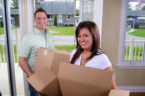 Careful moving team handling furniture in a Croydon townhouse