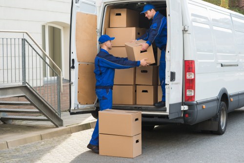 Careful handling of packed boxes and furniture during a move