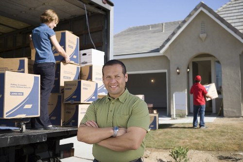 Furniture and boxes being unloaded at a Croydon property