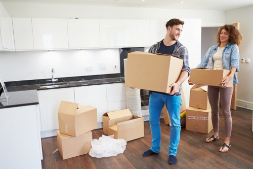 Professional movers loading furniture for a home move in Croydon
