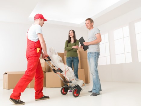 Packed boxes and furniture ready for removal in a Croydon home